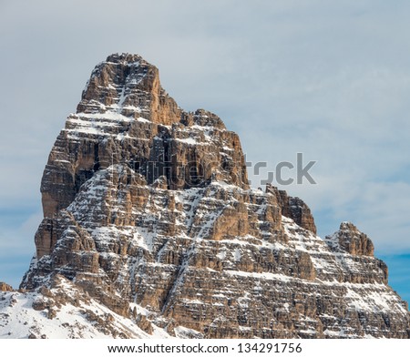 Dolomites, Italy. Great Rock still covered by snow at the end of winter season.