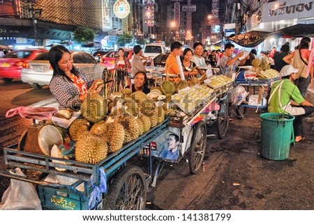 BANGKOK - AUG 18: Tourists and locals enjoy a street market, Augus 18, 2008 in Bangkok. Street markets are one of the most popular city tourist attraction.