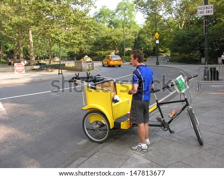 NEW YORK CITY - SEP 30: Unidentified pedicab driver awaits next customer in Central Park on September 30, 2006. Pedicab is an eccentric yet very traditional in perspective of touring New York.