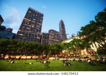 NEW YORK CITY - JUN 1: People enjoying a nice evening in Bryant Park on June 1, 2013 in New York City, NY. Bryant Park is a 9,603 acre privately managed park in the center of Manhattan
