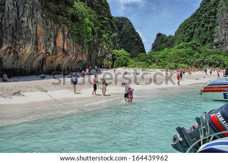PHI PHI ISLAND, THAILAND - AUG 11: Tourists enjoy wonderful thai nature, August 11, 2009 in Phi Phi Island, Thailand. Ko Phi Phi was devastated by the Indian Ocean Tsunami of December 2004.