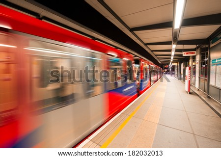 LONDON - AUG 22, 2013: Inside view of London underground and train. London\'s system is the oldest underground railway in the world, dating back to 1863