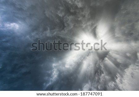Background of storm clouds before a thunder-storm with vanishing sun.