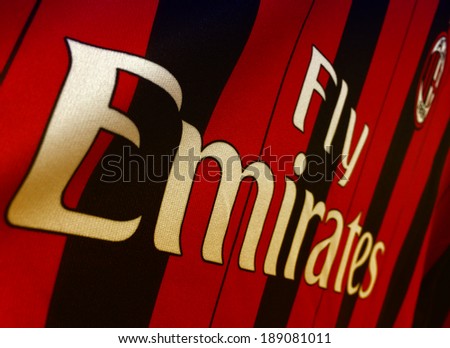 MILAN - NOV 23: Fly Emirates sign written on AC Milan shirt, November 23, 2013 in Milan. Emirates operates nearly 3,400 flights per week.