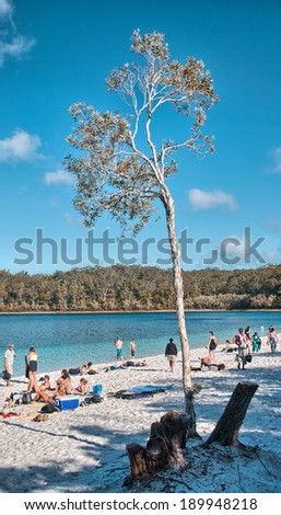 FRASER ISLAND, AUSTRALIA - JUL 11: Tourists enjoy Lake MacKenzie on a winter afternoon, July 11, 2010 in Fraser Island, Australia. The island is considered to be the largest sand island in the world.