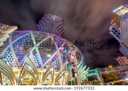 MACAU, CHINA - APR 18, 2014: Night lights of Grand Lisboa casino. The casino offers 800 mass gaming tables and 1000 slot machines.