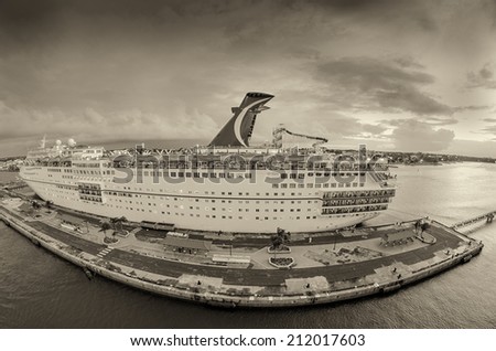 NASSAU, BAHAMAS - APRIL 20, 2009: Cruise ship anchored in the port at sunset. Most cruise lines include the islands of the Bahamas as a destination point on their itineraries