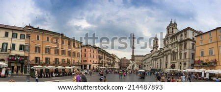 ROME - MAY 28, 2014: Tourist enjoy Piazza Navona in city center. More than 10 million people visit the city every year.