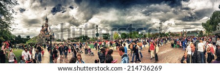 PARIS - MAY 16, 2014: People enjoy the nature of city park. More than 50 million people visit the city every year.