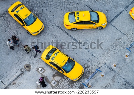 ISTANBUL, TURKEY - SEPTEMBER 13, 2014: Taxis await customers in a city square, aerial view. In Istanbul there are almost 20,000 taxis, most of them powered by clean LPG propane gas.
