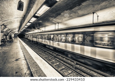 Pairs. Metro train speeding up in the subway.