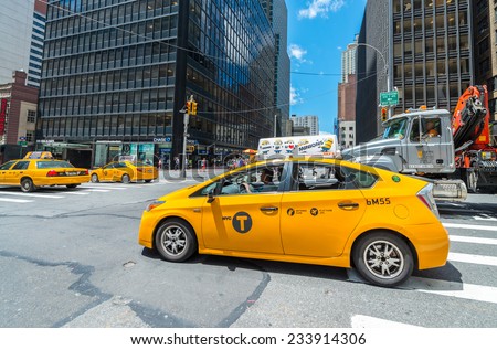NEW YORK - MAY 11: Taxicabs along Manhattan avenues. Licensed by the New York City Taxi and Limousine Commission, there are over 40.000 vehicles, on May 11, 2013 in New York City. USA