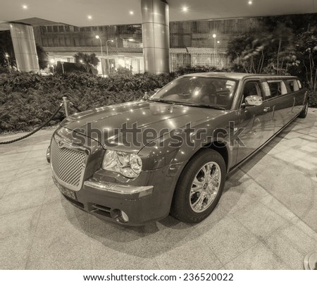 COTAI STRIP, MACAU - APRIL 22, 2014: Red Limousine in Casino parking. Macau is rivalling Las Vegas in gambling revenues, surpassing american city in 2007