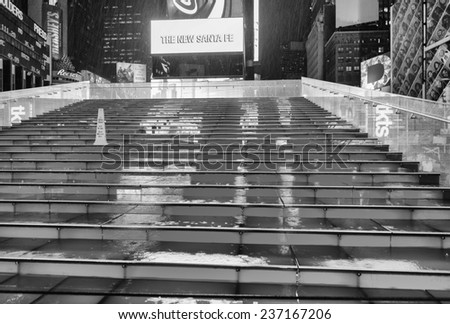 NEW YORK CITY - MAY 27:Wet red stairs of Duffy Square in Times Square May 27, 2013 in New York,NY.Times Square is the world\'s most visited tourist attraction bringing over 39 million tourists annually