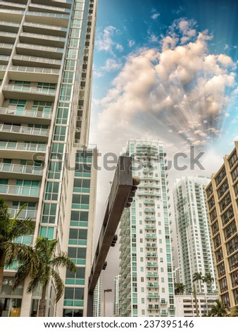 Miami skyline against dramatic sky. View from street level.