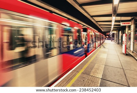 LONDON - AUG 22, 2013: Inside view of London underground and train. London\'s system is the oldest underground railway in the world, dating back to 1863
