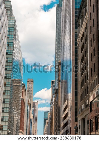 Manhattan. Wonderful view of tall skyscrapers from street level on a sunny day.