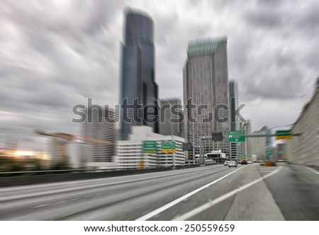 Blurred image of fast moving cars approaching Seattle.