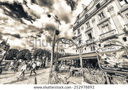 PARIS - MAY 21, 2014: Tourists walk in Quartier Latin. More than 30 million people visit Paris annually.