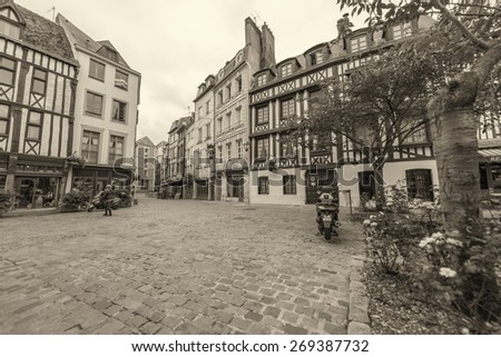 ROUEN, FRANCE - JUNE 16, 2014: Tourists walk along city streets. Rouen is visited by more than 3 million people annually.