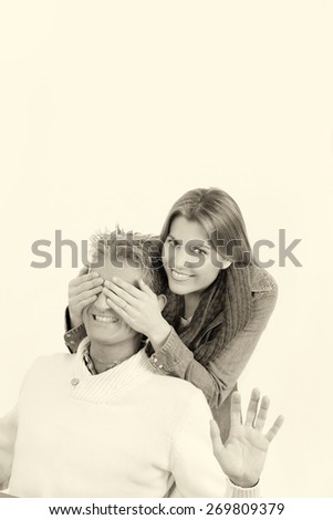 Happy couple. Woman hands covering man\'s eyes. Surprise concept. Isolated on white.