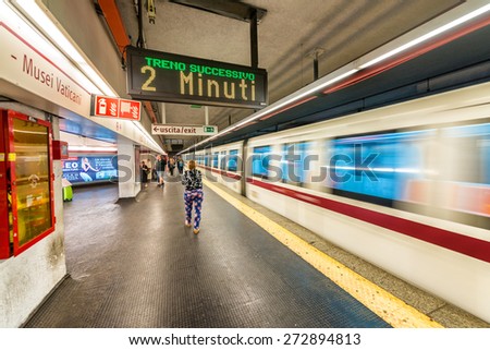 ROME - MAY 20, 2014: Tourists in city subway station. The city is visited by more than 10 million people every year.