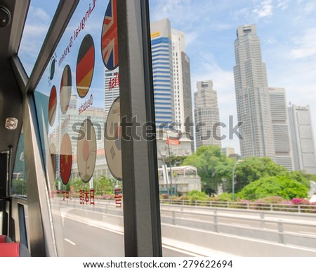 SINGAPORE - JULY 12, 2008: City streets on a beautiful summer day. More than 10 million people visit the city annually.