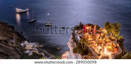 Classic night diner on a terrace above the ocean.