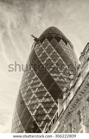 LONDON - JUNE 13: View of Gherkin building (30 St Mary Axe) at sunset in London on June 13, 2015. Gherkin - symbol of London, one of city's most widely recognized examples of modern architecture