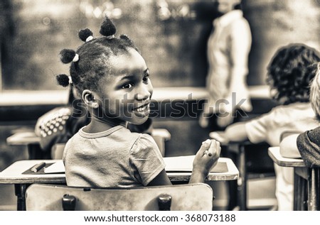 Happy african girl at elementary school. Success concept.