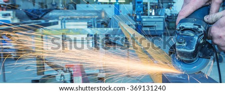 An industrial background. Welder in a factory.