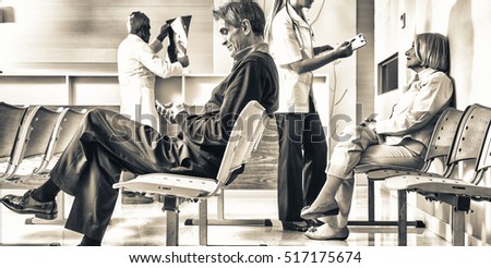 Patients and doctors speaking inside hospital waiting room.