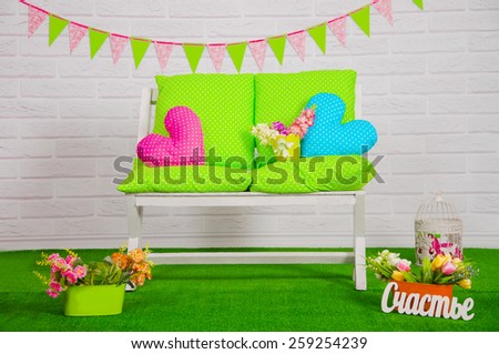 Spring scenery with bench and flowers