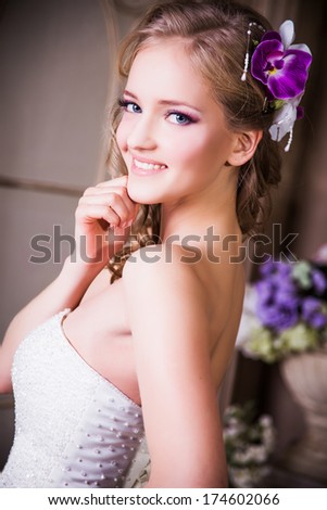 close-up portrait of beautiful blonde bride model with perfect make-up and hair style