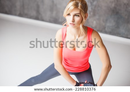 Beautiful blonde young woman in sport style