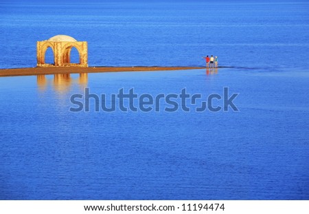 Relaxing in the Red Sea. Old mosque on the water  landscape. Idyllic sunset