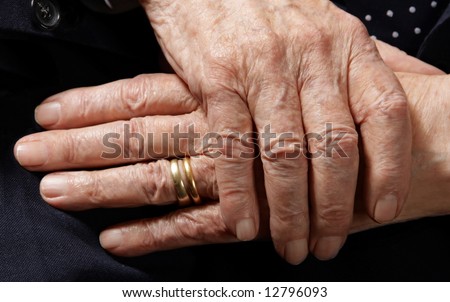 stock photo Hands of 103 years old man with two wedding rings