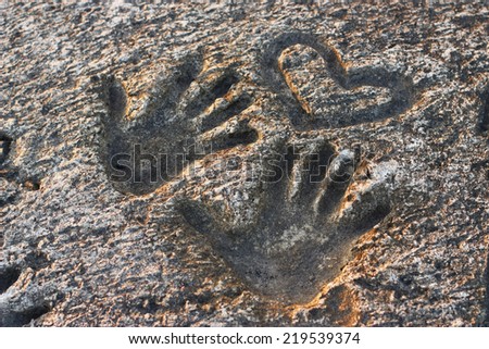 Hand prints in stone and concrete