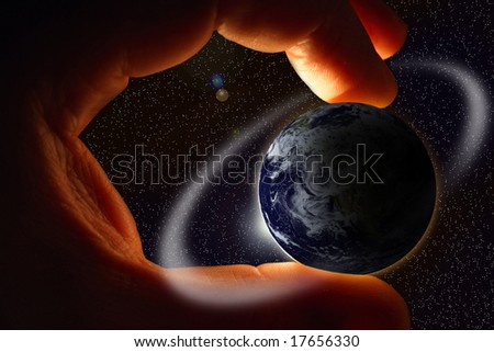 mans hand hold earth in open space