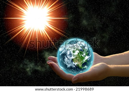 earth in woman hands against open cosmos space