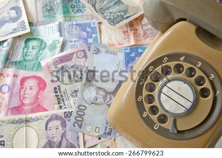 Old Telephone on money of various country, Business concept