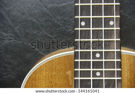 part and texture of brown wood ukulele