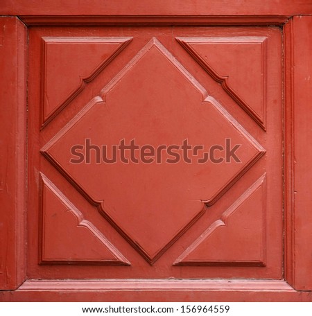 beautiful red paint on wood floral pattern of door and window interior