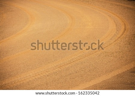 texture curve wheel track on orange soil and sand road