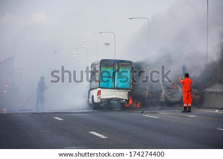 firefighters fire small truck with Truck caps car explosive car crash and catch fire on motorway