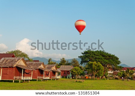Balloon over the land in the evening. Vang Vieng. Laos.