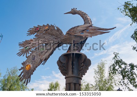 TOBOLSK, RUSSIA - JULY 7: Monument Firebird from a fairy tale in in the park Yershov on July 7, 2013, in Tobolsk. Pyotr Pavlovich Yershov was a Russian poet and author of the famous fairy-tale poem.