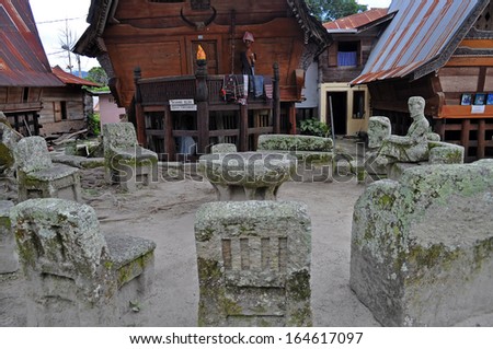 SAMOSIR, INDONESIA-NOV 25: Stone chairs of Ambarita where tribal elders held council on Nov 25, 2011. Ritual cannibalism practices remained a part of the culture of Batak people up until 19th century