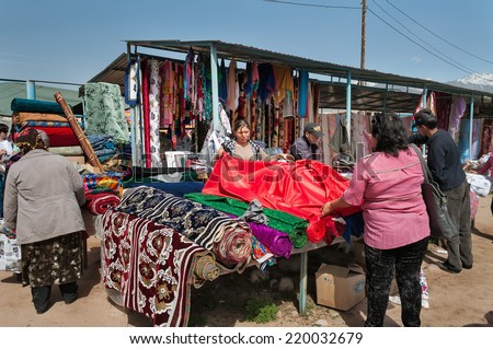 BOSTERI, KYRGYZSTAN - MAY 4, 2014: Sunday market. Bosteri is a village in the Issyk Kul Province of Kyrgyzstan. It is a popular resort village where a lot of hotels, resort