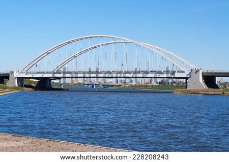 ASTANA, KAZAKHSTAN - MAY 10, 2014: Bridge Arkhar over the Ishim River. Astana is the capital city of Kazakhstan on 10 December 1997.  Population of 835153